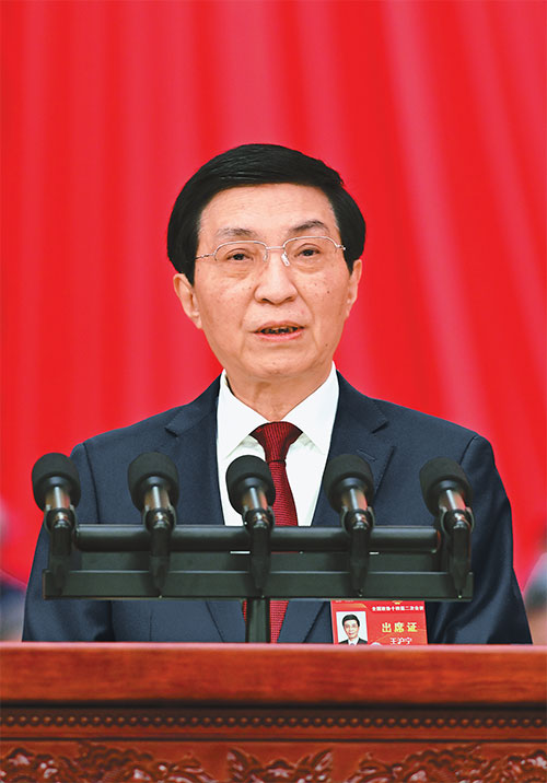 འདི་ནི་རྒྱལ་ཡོངས་སྲིད་གྲོས་ཀྱི་ཀྲུའུ་ཞི་ཝང་ཧུའུ་ཉིང་གིས་སྲིད་གྲོས་སྐབས་བཅུ་བཞི་པའི་རྒྱལ་ཡོངས་ཨུ་ཡོན་ལྷན་ཁང་རྒྱུན་ལས་ཨུ་ཡོན་ལྷན་ཁང་གི་ཚབ་ཞུས་ཏེ་ཚོགས་ཆེན་ལ་ལས་དོན་སྙན་སྒྲོན་གནང་བཞིན་པ།